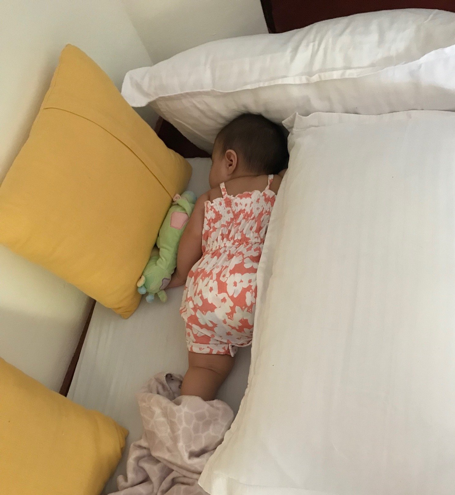 With no crib available at a home stay in Kerala, a floor mattress and pillows kept my daughter comfortable