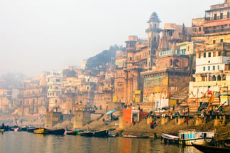 Legends of India, a small group tour. Enjoy a sunrise boat ride on the Ganges River in Varanasi.