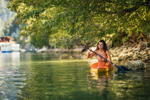 female-in-bikini-kayaking-on-lake-during-sunny-day-2023-02-15-20-27-22-utc (1)