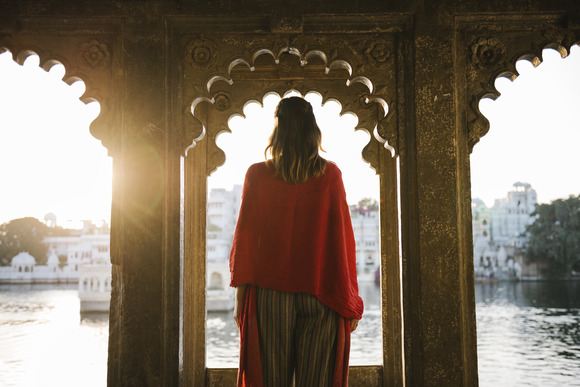 western-woman-standing-on-a-cultural-architecture-2022-12-16-01-25-07-utc (1)