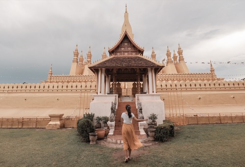 woman-walking-towards-pha-that-luang-vientiane-in-2022-03-07-22-43-54-utc (1)